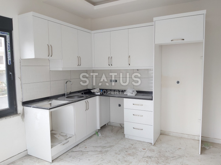 Квартира 1+1 в 100 метрах от моря в Кестеле, 48 м2. фото 1