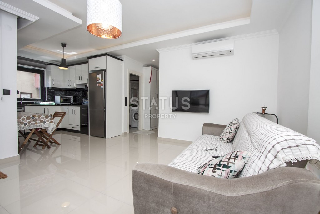 One-bedroom furnished apartment in an urban-type building on Cleopatra, 58m2 фото 1