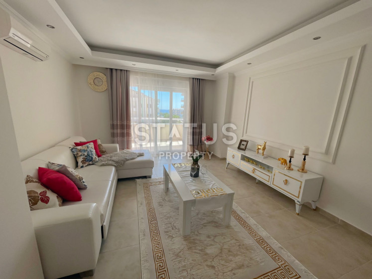 One bedroom apartment with partial sea view in Mahmutlar. 65m2 photos 1