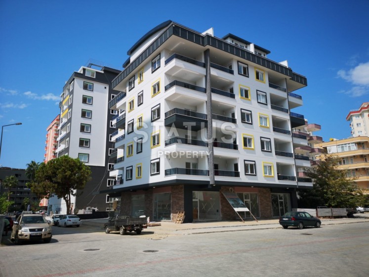 Новая квартира в новом комплексе в Махмутларе, 68 м2. фото 1