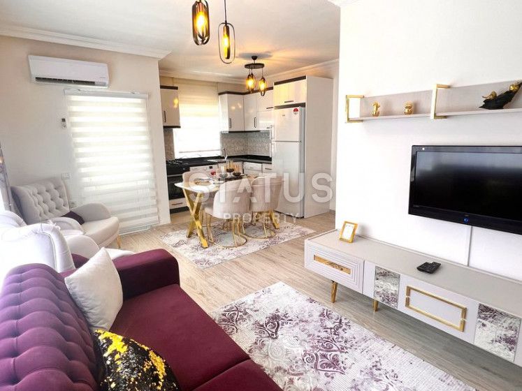 Three-room furnished apartment in an urban-type building in Mahmutlar. 90m2 photos 1