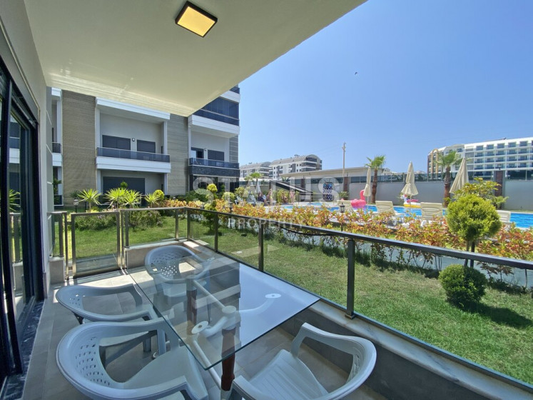 Garden duplex 2+1 at 250 250m from the sea in a residential complex with full infrastructure in Kargicak. 106m2. photos 1