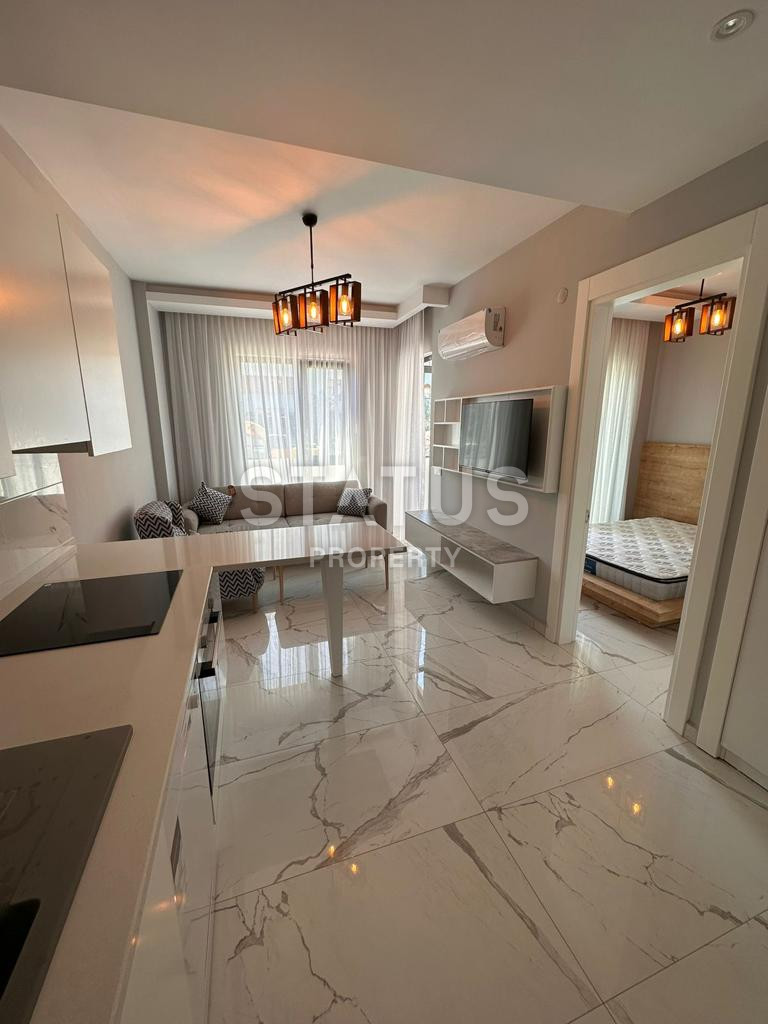One-bedroom apartment with furniture in a new complex 100 meters from the beach in the center of Alanya. 50m2 фото 1