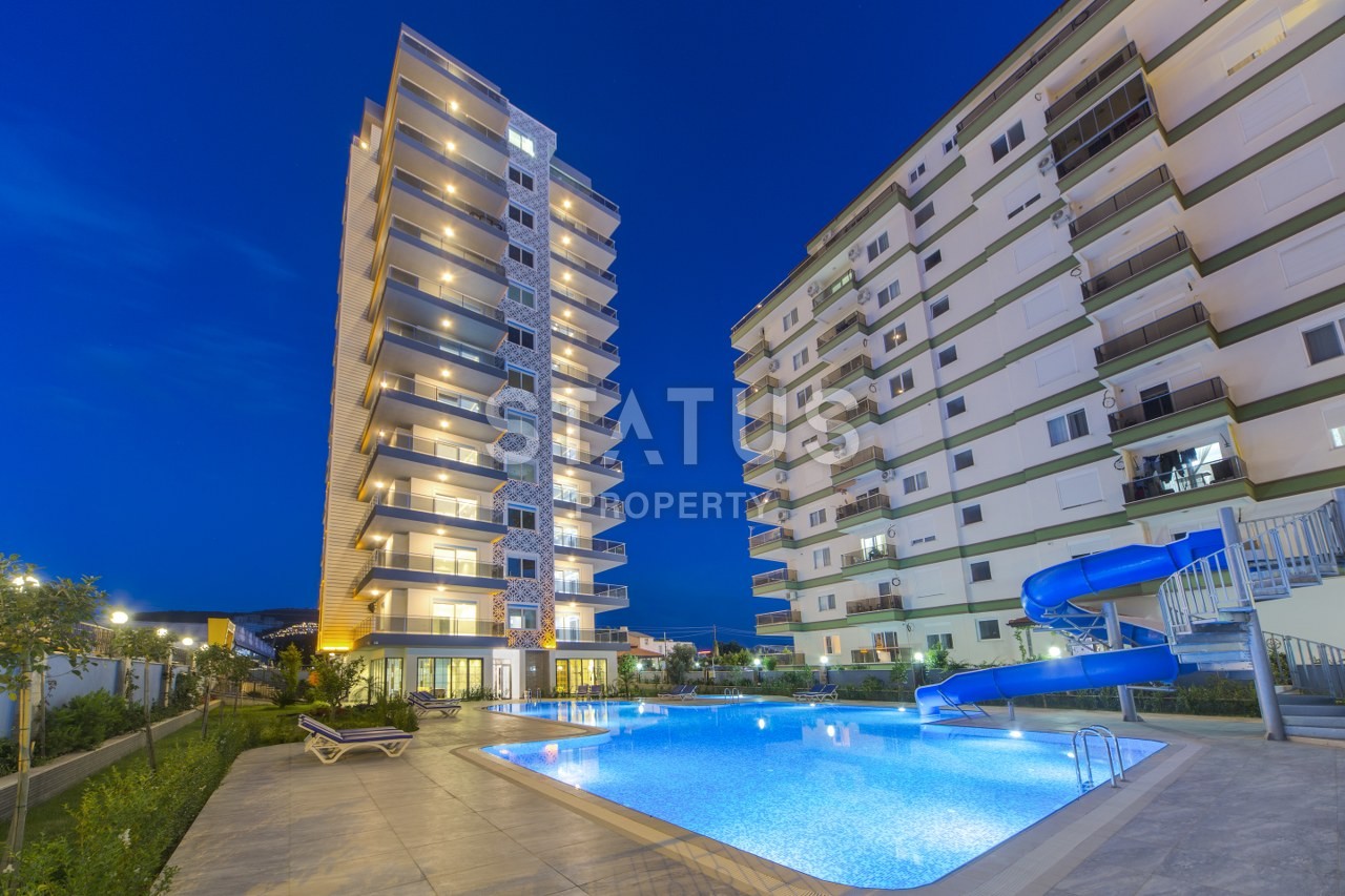 New complex with sea view apartments in Mahmutlar! фото 1