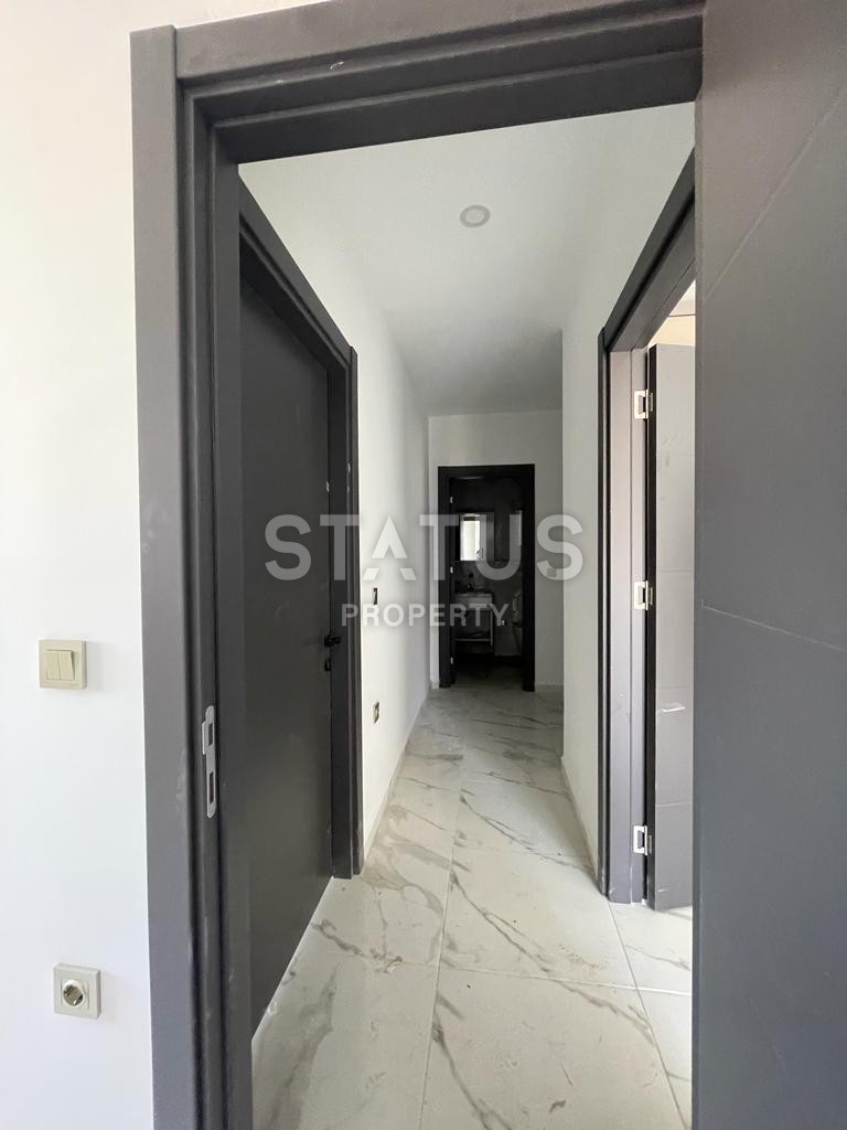 Spacious new three-room unfurnished apartment in Mahmutlar, 80m2 фото 2