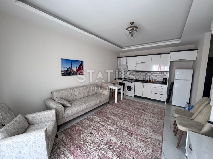 Квартира 1+1 с мебелью в Махмутларе, 52 м2 фото 1