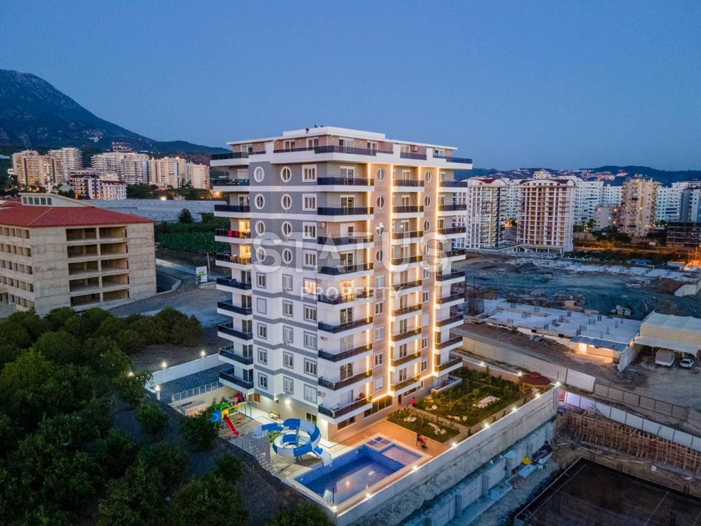 Luxurious three-room apartment in a new complex, Mahmutlar, 110 m2 фото 1