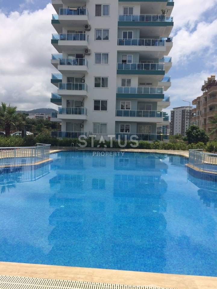 Apartment 1+1 with furniture and appliances, 55 m2 in Mahmutlar. фото 2