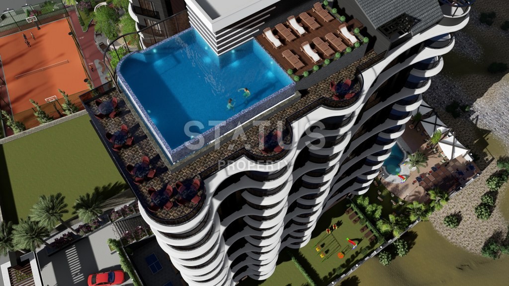 Новый инвестиционный проект повышенного комфорта с инфинити бассейном на крыше в районе Махмутлар 65-135 кв.м. фото 2