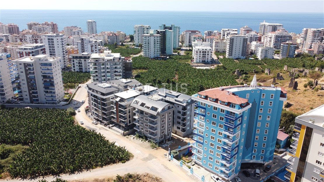 Apartment 1+1 with a view of Naulu in a new complex in Mahmutlar, 55 m2. фото 1