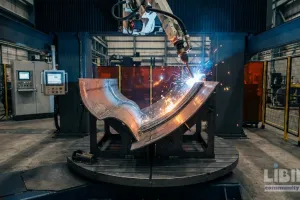 Wire-arc additive manufacturing in naval shipbuilding: analyzing Newport News' six-machine ARCEMY strategy and its implications for the Navy
