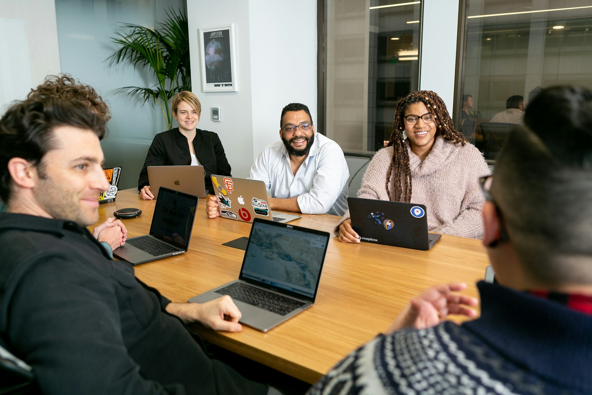 Professional working carefully through email replies on a laptop