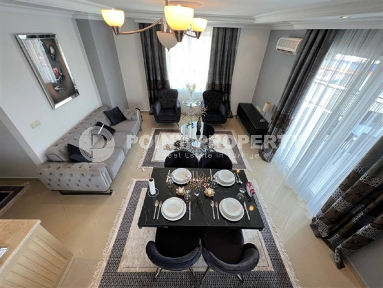 View apartment 2+1, 140m², with designer interior in Alanya Tosmur area-id-1495-photo-1