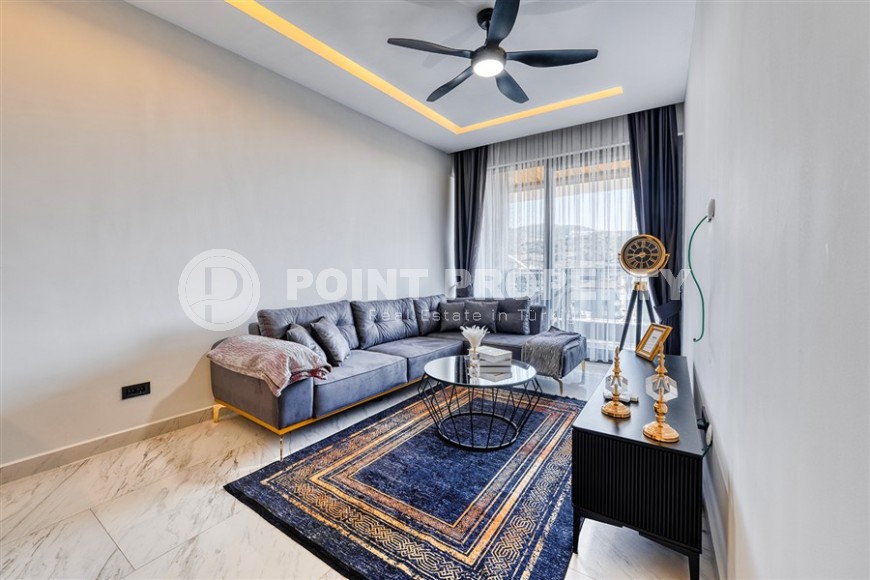 Modern apartment in a luxury residential complex on the first line from the sea, in the center of a picturesque, ecologically clean area of Alanya - Kargicak-id-6561-photo-1