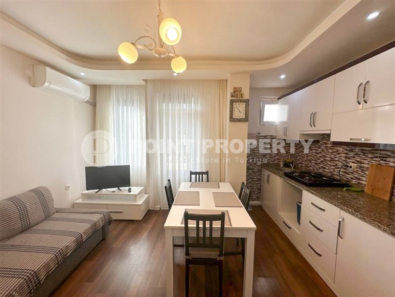 Inexpensive furnished apartment 1+1, on an area of 55 m2, in a building built in 2010, in the center of Mahmutlar district-id-6649-photo-1