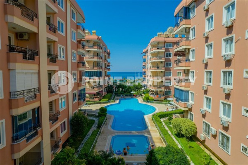 Designer two-bedroom apartment, 115m² in a cozy complex on the seafront in Mahmutlar-id-1530-photo-1