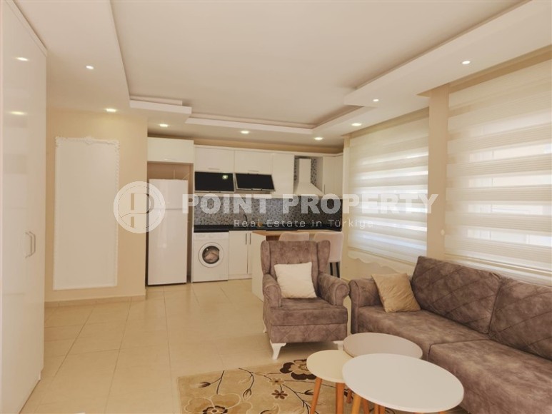 Bright, comfortable apartment with modern design, 500 meters from the sea, in the center of Mahmutlar-id-6831-photo-1