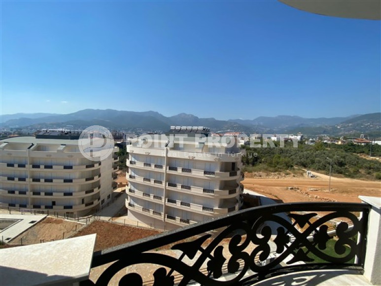 New view three-room apartment, 85m² at the foot of the mountains in Upper Oba, Alanya-id-1535-photo-1