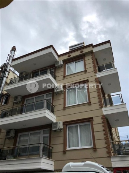 4-storey building with six apartments and a cafe on the 1st floor, in the center of Alanya-id-6917-photo-1