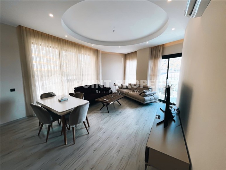Симпатичная просторная квартира с современным дизайном, в 50 метрах от моря, в живописном районе Аланьи - Каргыджак-id-6941-фото-1