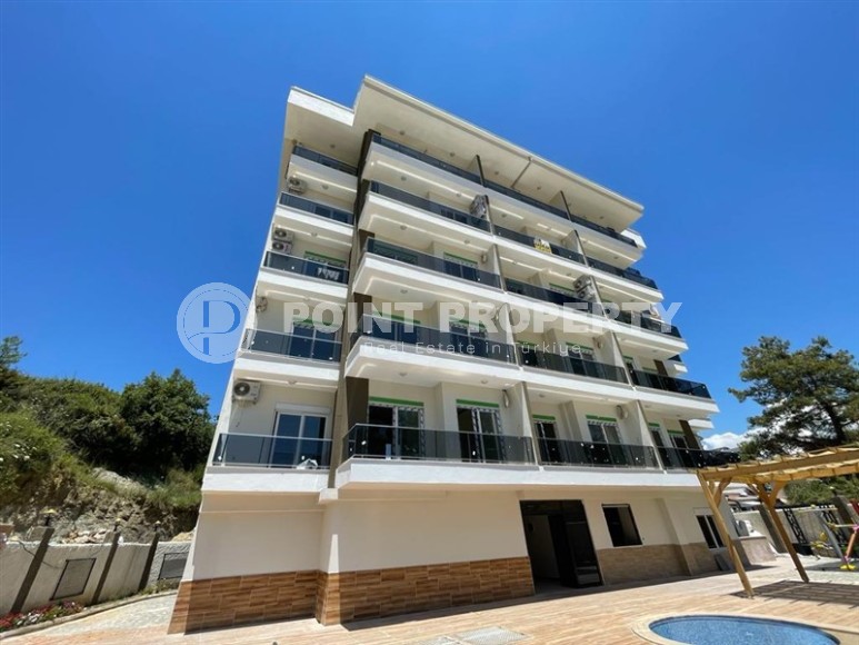 Apartment in a commissioned residential complex in a promising area of Alanya - Avsallar, two kilometers from the sea-id-7086-photo-1