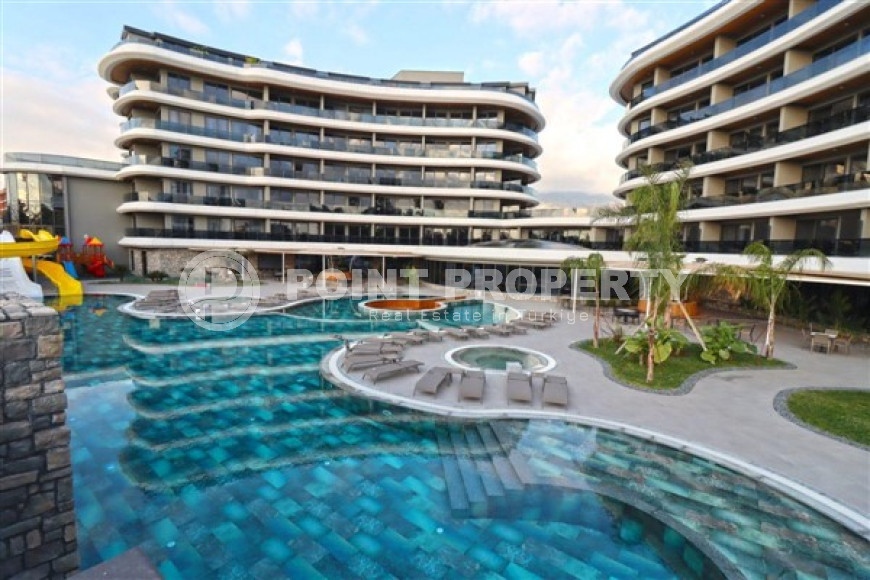 Cozy one-bedroom apartment, 62m², on the first coastline in Kargicak, Alanya.-id-1560-photo-1