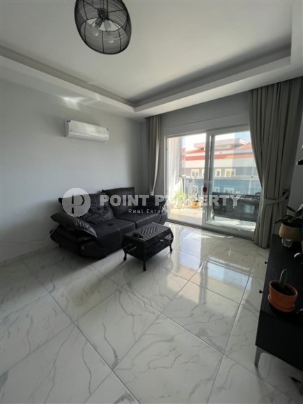 Compact 1+1 apartment with a spacious glazed balcony, in a prestigious area of Alanya - Upper Oba-id-7201-photo-1