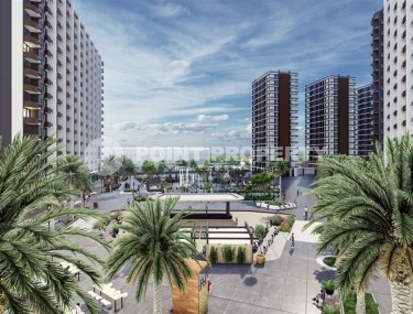 Новый инвестиционно привлекательный проект в курортном районе Мерсина - Тарсус - масштабный жилой комплекс, состоящий из семи 15-этажных блоков, в десяти километрах от моря-id-7251-фото-1