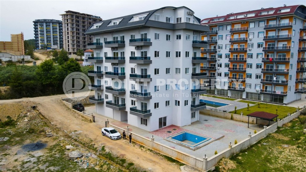 Inexpensive apartment with fine finishing two and a half kilometers from the sea, in a promising area of Alanya - Avsallar-id-7323-photo-1