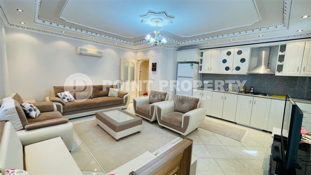 Недорогая квартира с двумя спальными комнатами и просторными застекленными балконами в центре района Махмутлар-id-7624-фото-1