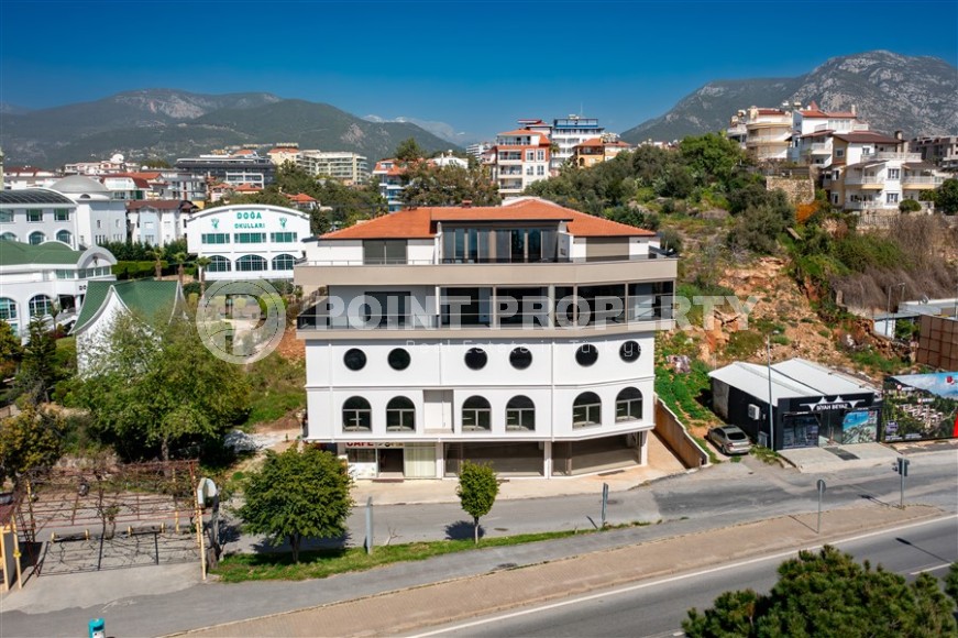 New four-storey building for commercial outlets in the prestigious resort area of Alanya - Kestel-id-7842-photo-1