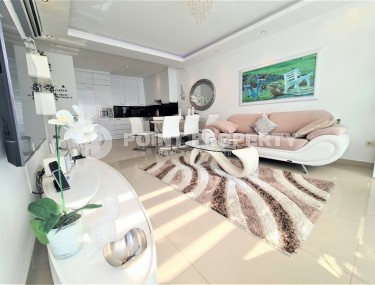 Atmospheric 2+1 apartment with modern design, stylish furniture and household appliances in a quiet area of Alanya - Tosmur-id-7921-photo-1