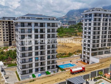 Compact new apartment with fine finishing 750 meters from the sea, in the center of Mahmutlar-id-7943-photo-1