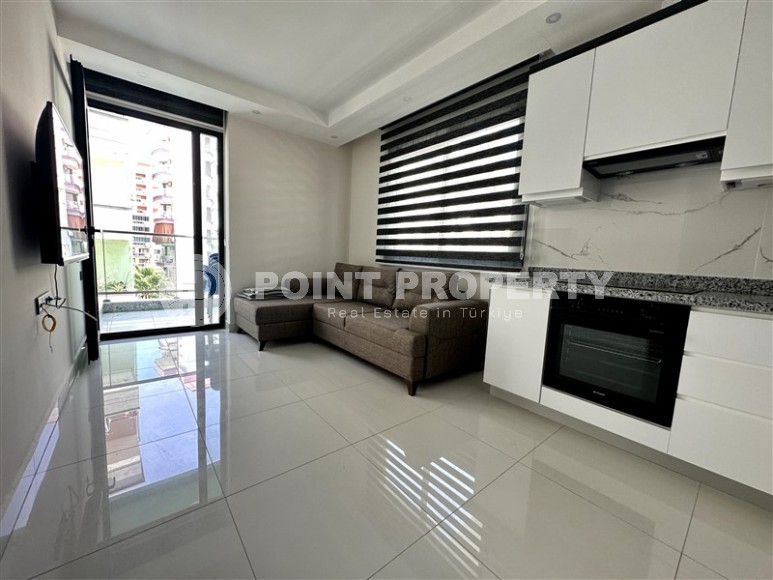 Compact furnished apartment 300 meters from the sea, in the center of Mahmutlar-id-7964-photo-1