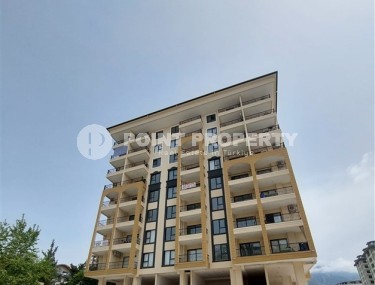 Cozy 1+1 apartments under construction, Mahmutlar, 400 meters from the sea.-id-1498-photo-1