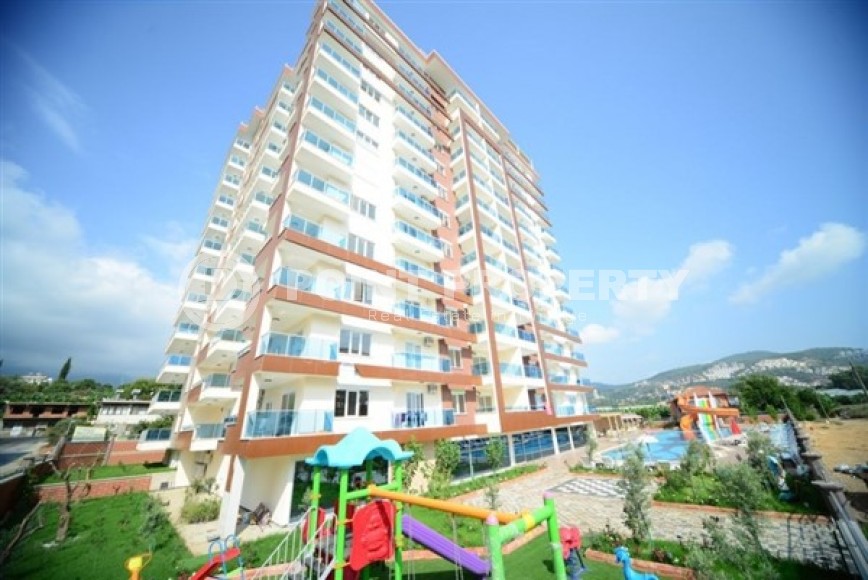 Spacious 1+1 apartment, with a total area of 70 m2, on the 3rd floor in a residential complex with hotel infrastructure in the center of Mahmutlar district-id-8002-photo-1