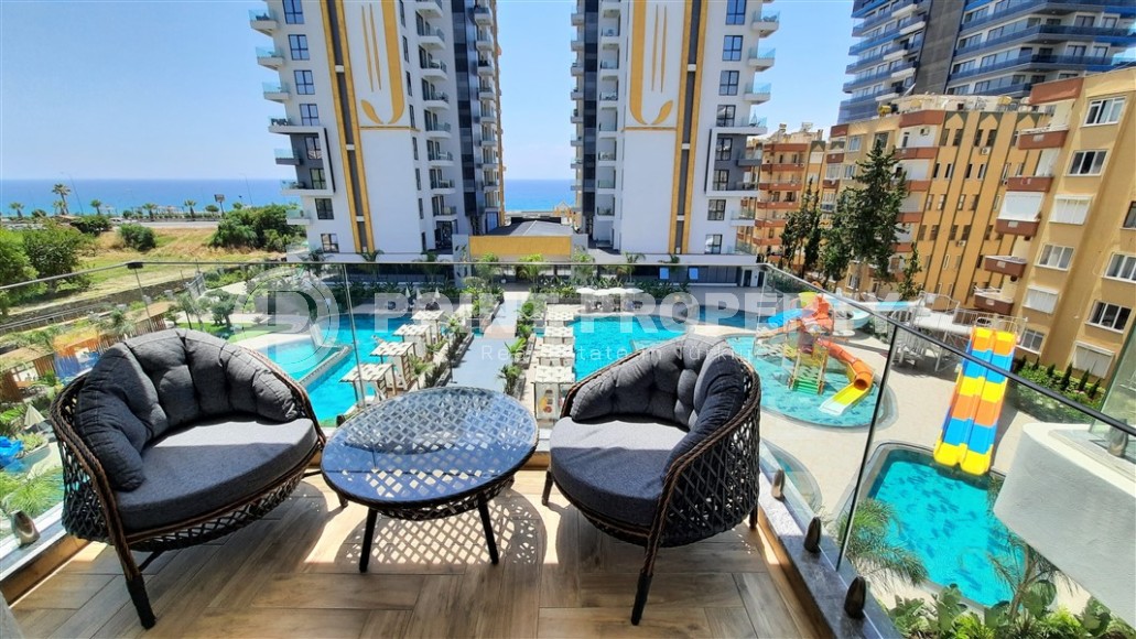 Cozy apartment overlooking the sea and the infrastructure of the complex in Mahmutlar, Alanya.-id-8141-photo-1