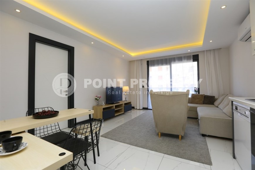 Cozy 1+1 apartment in a modern building on the 2nd floor, in the center of Alanya-id-8165-photo-1