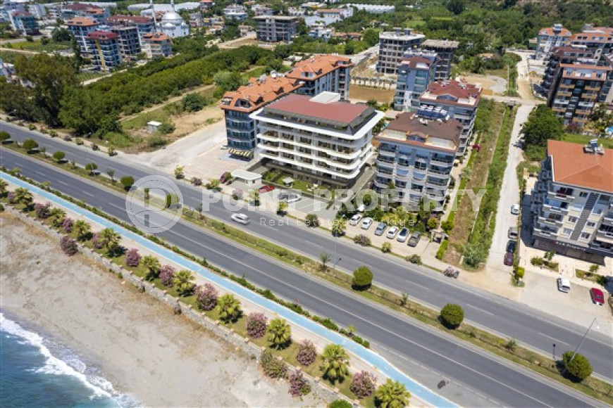 Квартиры разных планировок в комплексе на берегу моря в районе Кестель, Алания, от строительной компании-id-1647-фото-1
