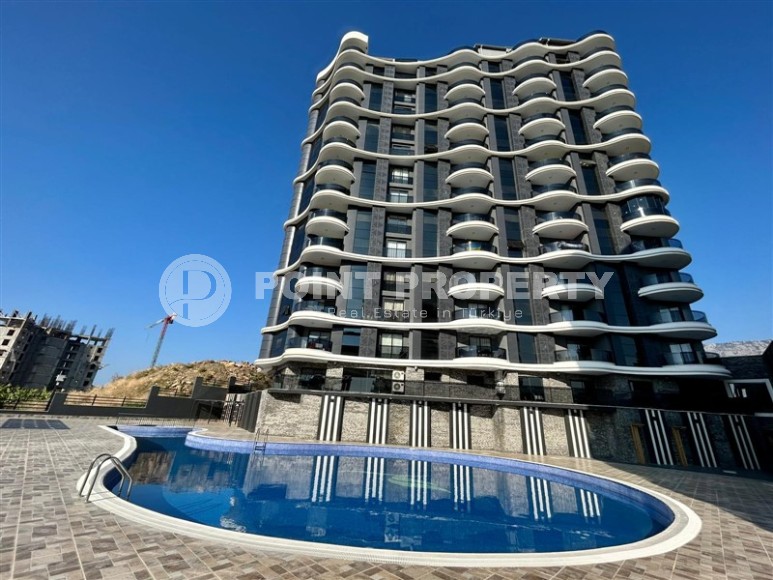 65 m² apartment in a new complex with infinity pool in Mahmutlar-id-8333-photo-1