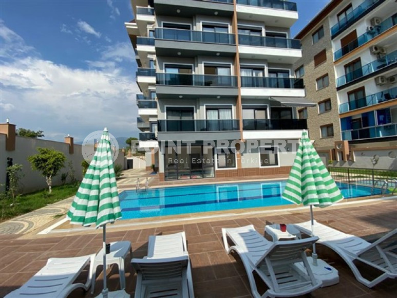 Furnished two-room apartment 1+1, in a new residence 250m from the sea in the Kestel area, Alanya-id-1662-photo-1
