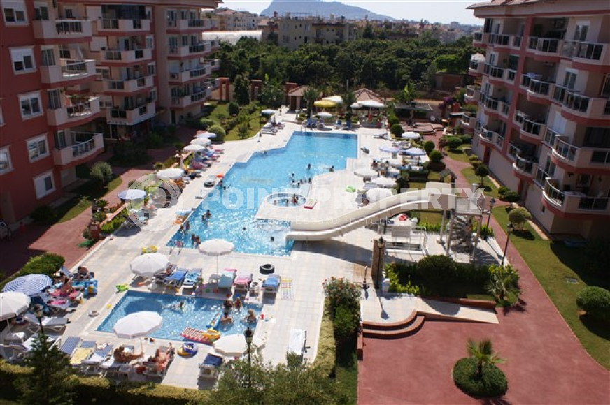 Three-room apartment, 115m², with mountain views in a residence with good infrastructure in Oba, Alanya-id-1666-photo-1