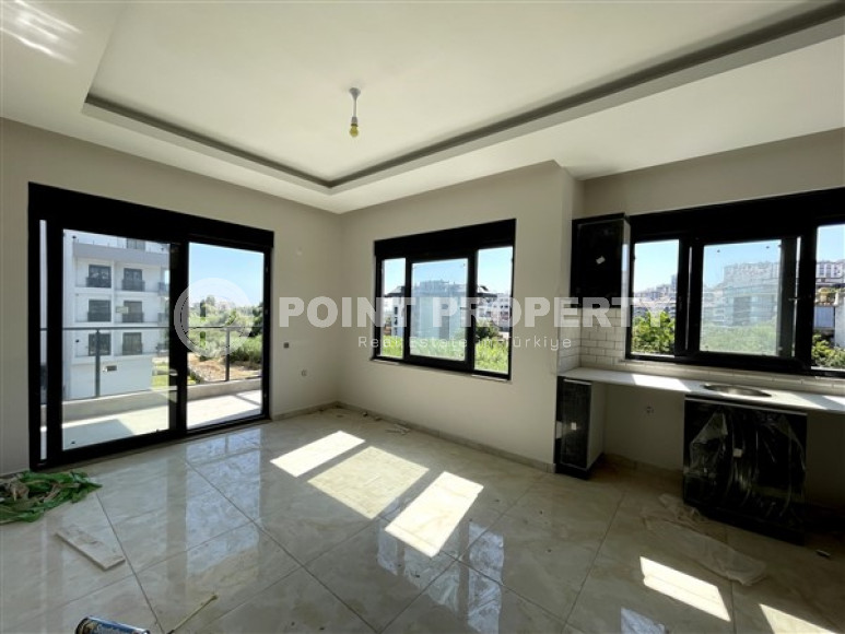 Apartment 1+1, 49 m², in a complex with infrastructure at the commissioning stage in the Oba area, Alanya-id-1668-photo-1