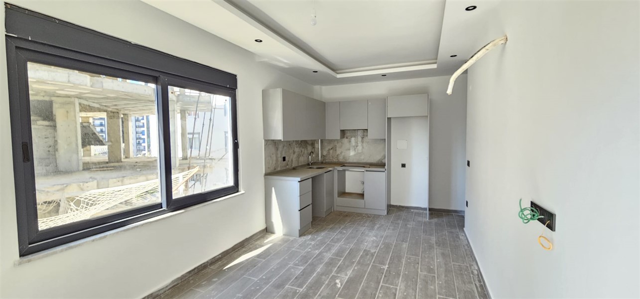 Новая квартира 50 м² по хорошей цене в Махмутларе-id-8596-photo-1