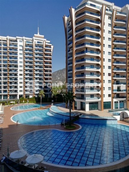 Large apartment 1+1, 65m², in an elite residence at the foot of the Taurus Mountains in Mahmutlar, Alanya-id-1678-photo-1