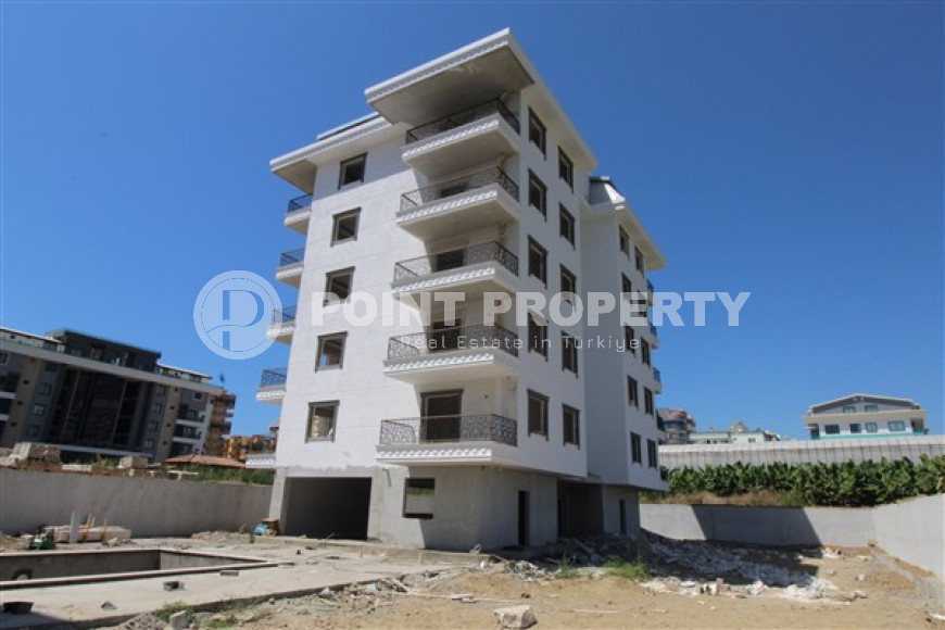 One-bedroom apartment, 75m², in a complex in the final stage of construction by the sea, in Kargicak, Alanya-id-1700-photo-1