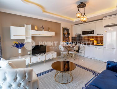 Furnished 1+1 apartment in a complex with an excellent location in the Mahmutlar area, 55 m2.-id-1109-photo-1