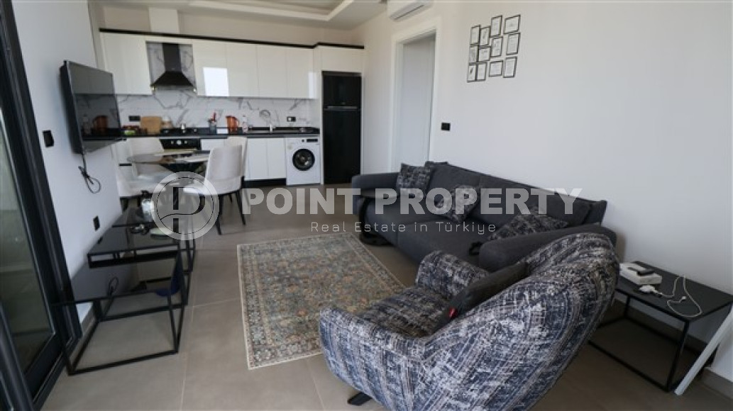 One-bedroom apartment, 72m², in a new premium complex in Kargicak, Alanya.-id-1837-photo-1