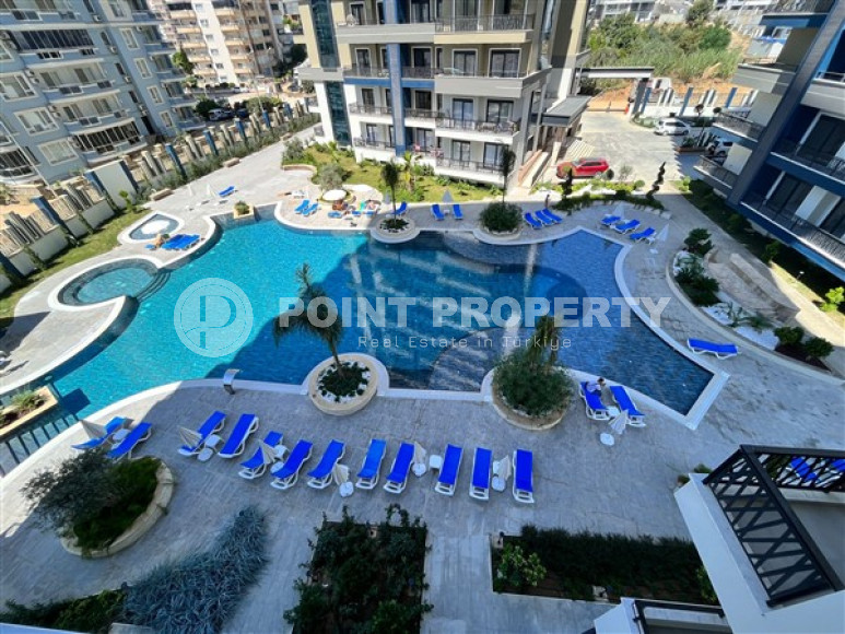 Apartment 1+1, 56m2 in the popular area of Mahmutlar. 750 meters to the sea.-id-2081-photo-1
