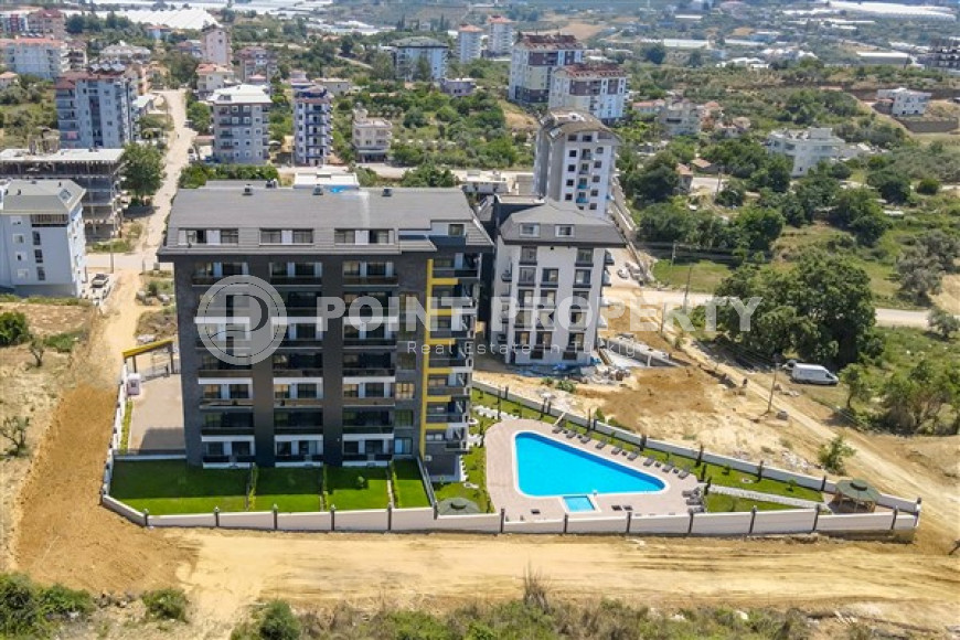 Two-room apartment with a private garden, 1500 meters from the sea, Avsallar area-id-2245-photo-1